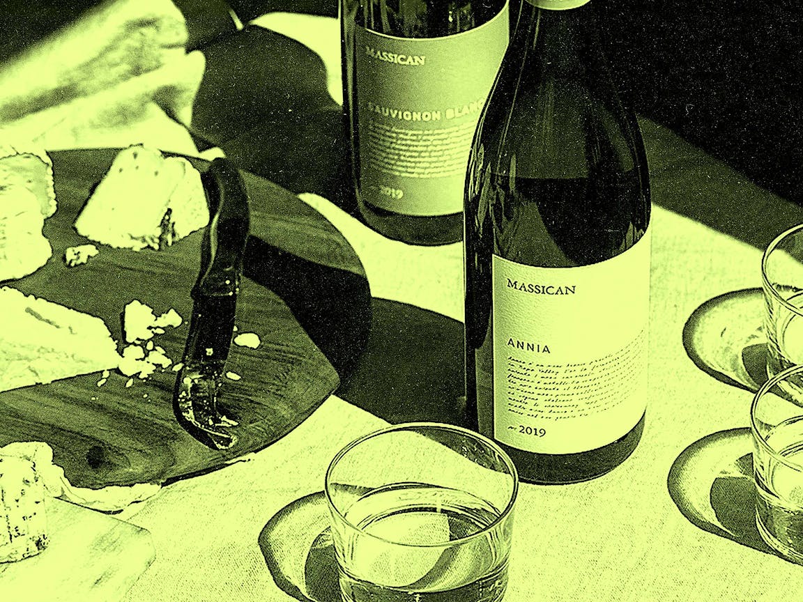 A photo of wine and cheese.